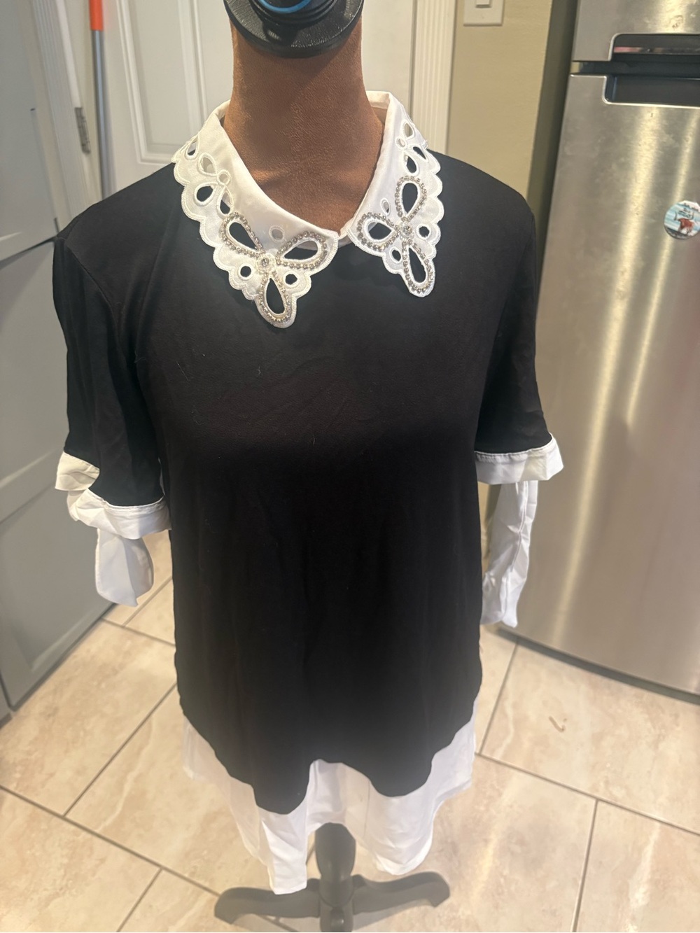Misia Black Tunic with White Eyelet Collar and Layered Hem